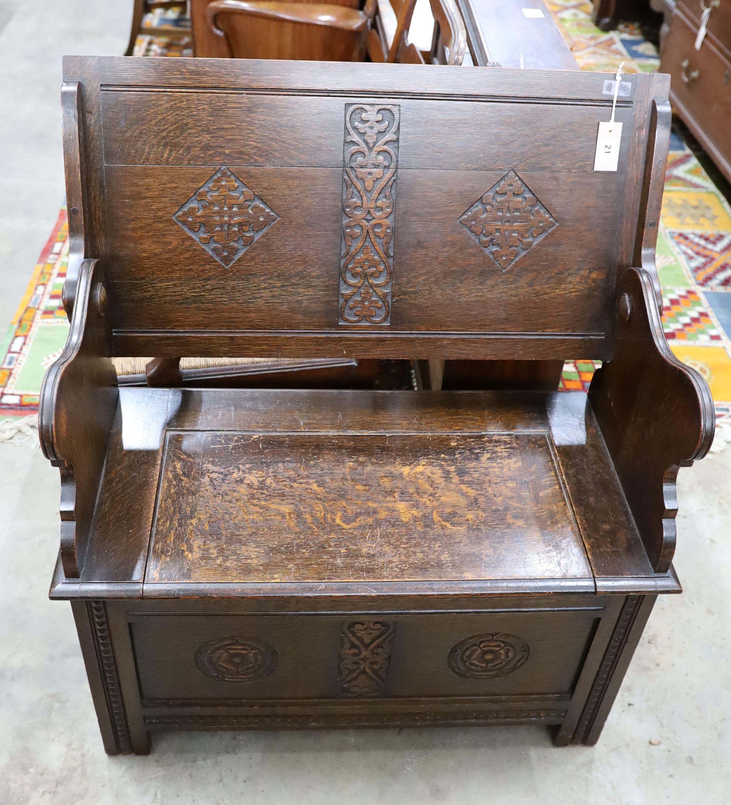 A 1930's oak monk's bench, length 87cm, depth 44cm, height 77cm